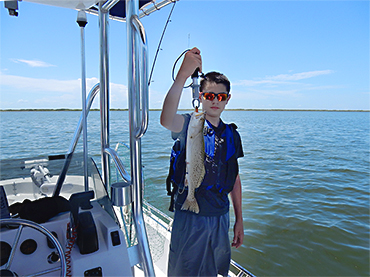 https://www.texasguidefishing.com/wp-content/uploads/2019/07/Michael_with-his-first-saltwater-speckled-trout-catch-sml.jpg